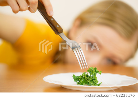 Sad young woman being on diet Sad young woman being on diet 62225170
