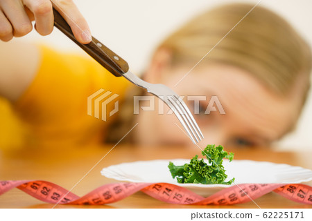 Sad young woman being on diet Sad young woman being on diet 62225171