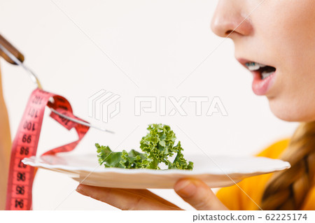 Sad young woman being on diet 62225174