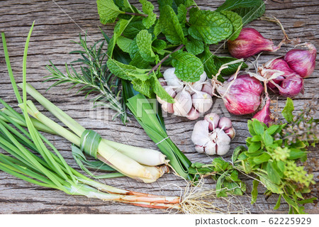 Natural fresh herbs and spice on rustic wood 62225929