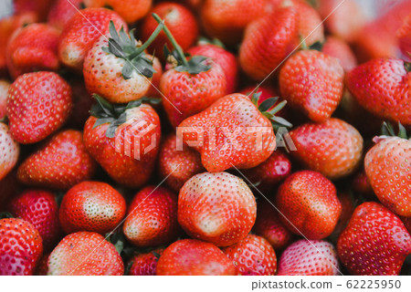 Pile of ripe strawberry for sale in the market Pile of ripe strawberry for sale in the market 62225950