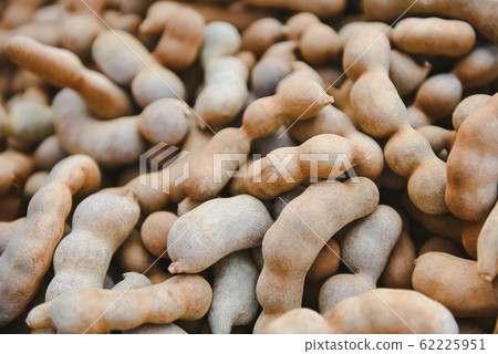 Pile of sweet tamarind for sale in the market Pile of sweet tamarind for sale in the market 62225951