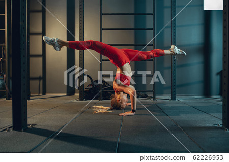 The female athlete training hard in the gym. Fitness and healthy life concept. The female athlete training hard in the gym. Fitness and healthy life concept. 62226953