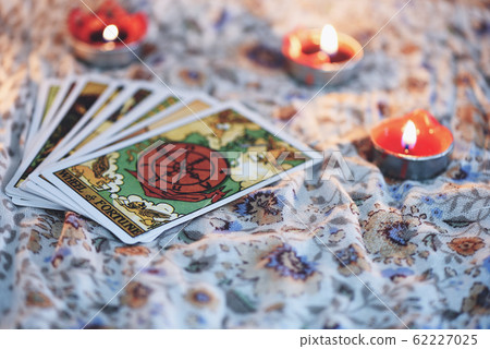 Tarot card with candlelight on the darkness 62227025
