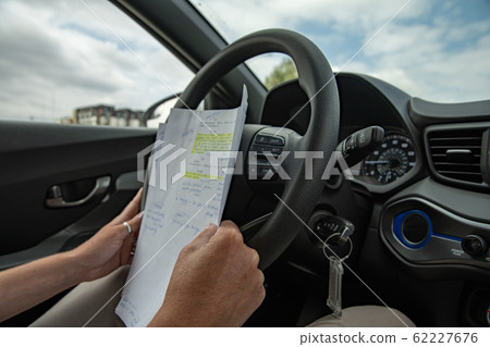 studying in a car in a queue during traffic jams studying in a car in a queue during traffic jams 62227676