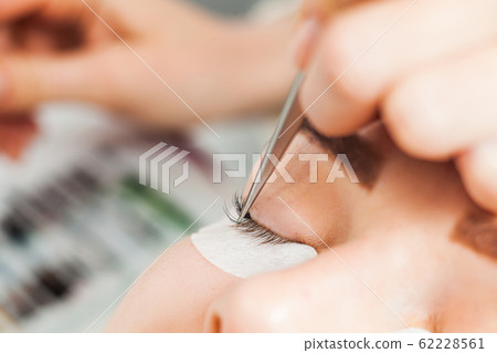 Beautiful woman with long eyelashes in a beauty salon 62228561