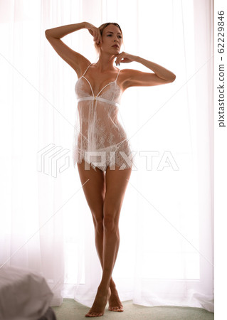 Defocus. High key light silhouette of a beautiful Defocus. High key light silhouette of a beautiful 62229846