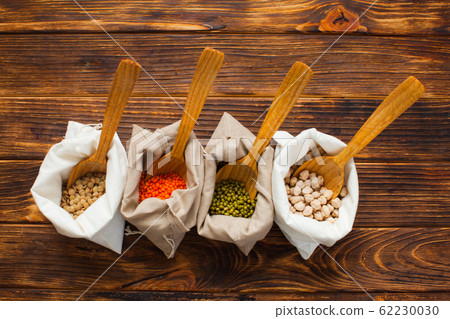 Eco pouches with chickpeas, beans, lentils, mash, top view. Zero waste concept. Eco pouches with chickpeas, beans, lentils, mash, top view. Zero waste concept. 62230030