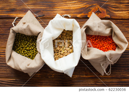 Cotton bags with beans, lentils, mash. Zero waste shopping concept, flat lay Cotton bags with beans, lentils, mash. Zero waste shopping concept, flat lay 62230036