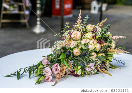 Wedding bouquet of flowers for wedding bride closeup. colorful flowers 62231321
