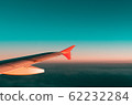 Wing viewed from airplane window 62232284