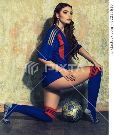 Young sexy woman football player. Young sexy woman football player. 62235610