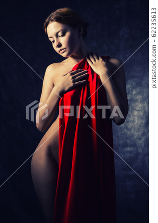 Beautiful woman with red tissue around her waist Beautiful woman with red tissue around her waist 62235613