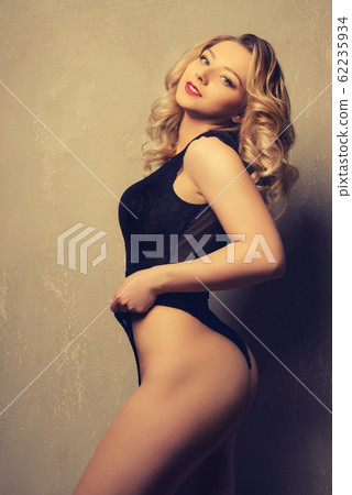 young beautiful lady posing in lace body 62235934
