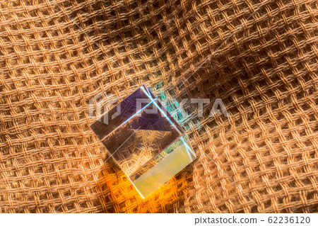 Colorful bright glass prism cube  Refracting light 62236120