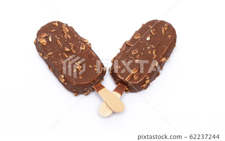 Chocolate ice cream with nuts on a stick. Isolated Chocolate ice cream with nuts on a stick. Isolated 62237244