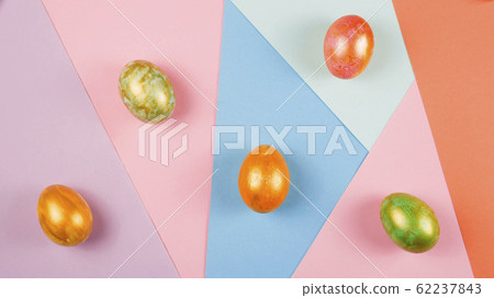 Easter eggs of different colors on the background Easter eggs of different colors on the background 62237843