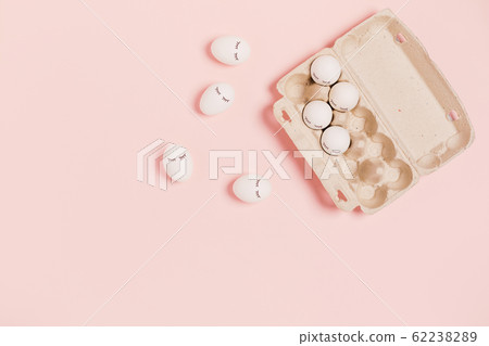 Eggs on a pink background. Eggs on a pink background. 62238289