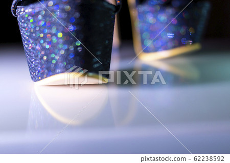 Sexy high heel shoes sparkle with colorful lovely glints in bokeh Sexy high heel shoes sparkle with colorful lovely glints in bokeh 62238592