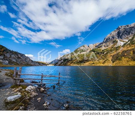 Sunny autumn alpine Tappenkarsee lake and rocky mountains above, Kleinarl, Land Salzburg, Austria. 62238761