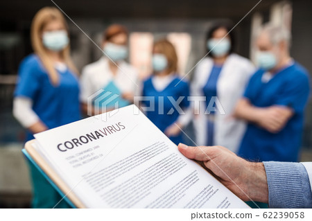 Group of doctors talking about corona virus on conference. 62239058