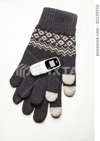 winter gloves mobile phone white background winter gloves mobile phone white background 62239558