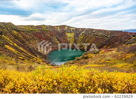 Volcanic crater Kerid with blue lake inside, Iceland tourist attraction Volcanic crater Kerid with blue lake inside, Iceland tourist attraction 62239829