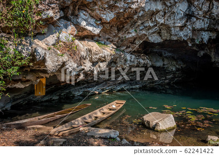 Wooden boat at Buddha cave, Thakhek loop, Laos Wooden boat at Buddha cave, Thakhek loop, Laos 62241422