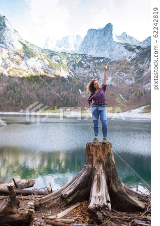 beautiful girl sitting on a stump beautiful girl sitting on a stump 62242819