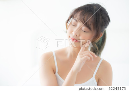 Portrait of beautiful young asian woman smile while wake up healthy and wellness Portrait of beautiful young asian woman smile while wake up healthy and wellness 62245173