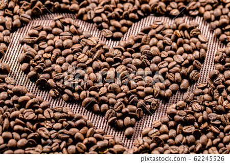 The fried coffee beans lie in the shape of a 62245526