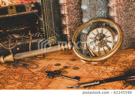 Antique clock on the background of a magnifying Antique clock on the background of a magnifying 62245590