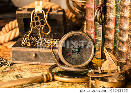 Antique compass on the background of a treasure 62245595