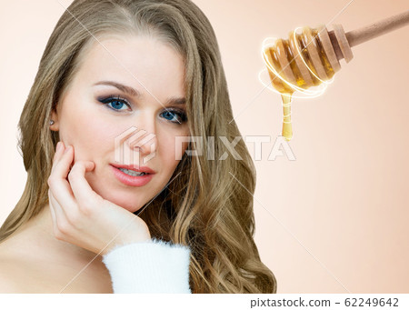 Adult woman and honey spoon prepare for facial mask. Adult woman and honey spoon prepare for facial mask. 62249642