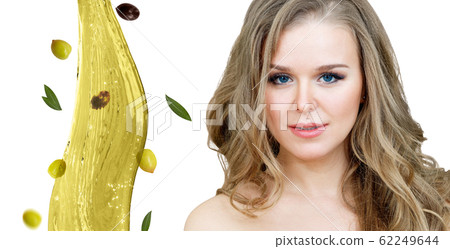 Beautiful woman near splash of olive oil. Skincare concept. Beautiful woman near splash of olive oil. Skincare concept. 62249644