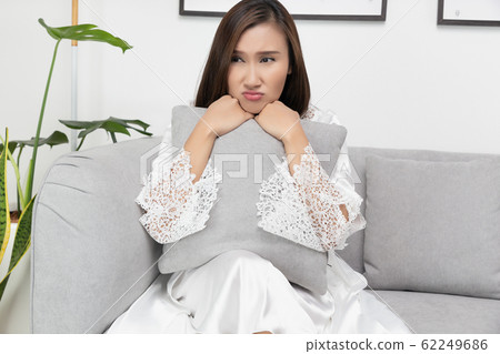 Serious angry woman portrait on a room Serious angry woman portrait on a room 62249686