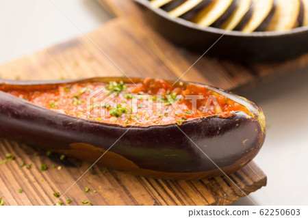 Grilled eggplant with hot spicy sauce. Grilled eggplant with hot spicy sauce. 62250603