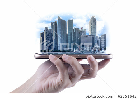 A Man hand holding the modern building of Business financial district and commercial on smartphone , concept of industrial construction and success with technology 62251642