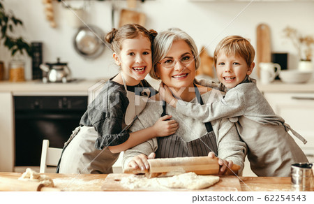happy family grandmother and grandchildren cook in happy family grandmother and grandchildren cook in 62254543