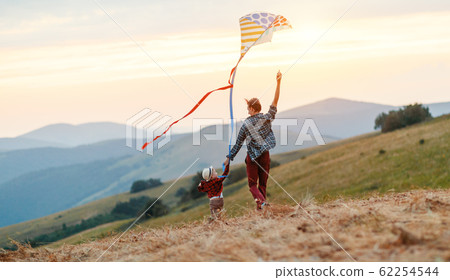 happy family father and child son launch kite on happy family father and child son launch kite on 62254544