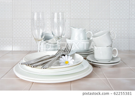 Clean dishes on the kitchen table 62255381