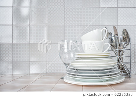 Clean dishes on the kitchen table 62255383