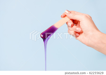 depilation and beauty concept - sugar paste or wax depilation and beauty concept - sugar paste or wax 62255629