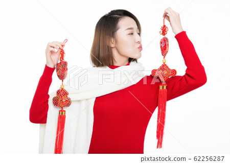 pretty girl holding chinese new year decoration 62256287