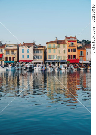 Colorful buildings and boats in the port of Cassis. 62256816