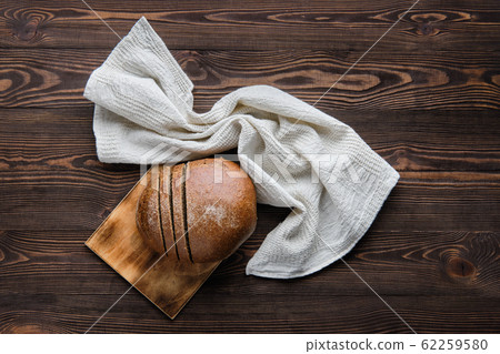 Rue brown bread on cutting board Rue brown bread on cutting board 62259580