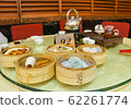 Having dim sum for breakfast at a restaurant in Foshan City, Guangdong Province, China. Having dim sum for breakfast at a restaurant in Foshan City, Guangdong Province, China. 62261774