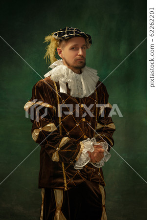 Medieval young man in old-fashioned costume 62262201