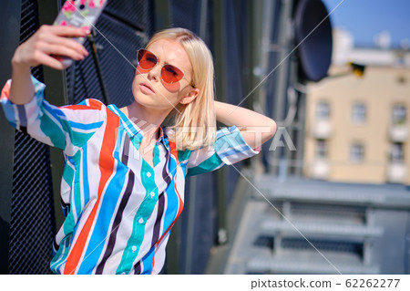 Selfie-portrait of pretty girl with blonde hair at Selfie-portrait of pretty girl with blonde hair at 62262277