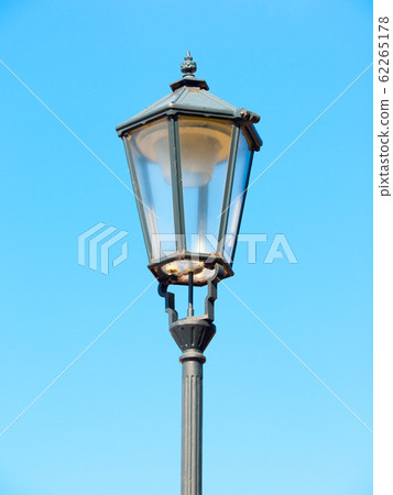 Old street lamp in Prague. Detailed view with blue sky background Old street lamp in Prague. Detailed view with blue sky background 62265178